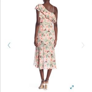 Beautiful form fitting  ruffled silk dress